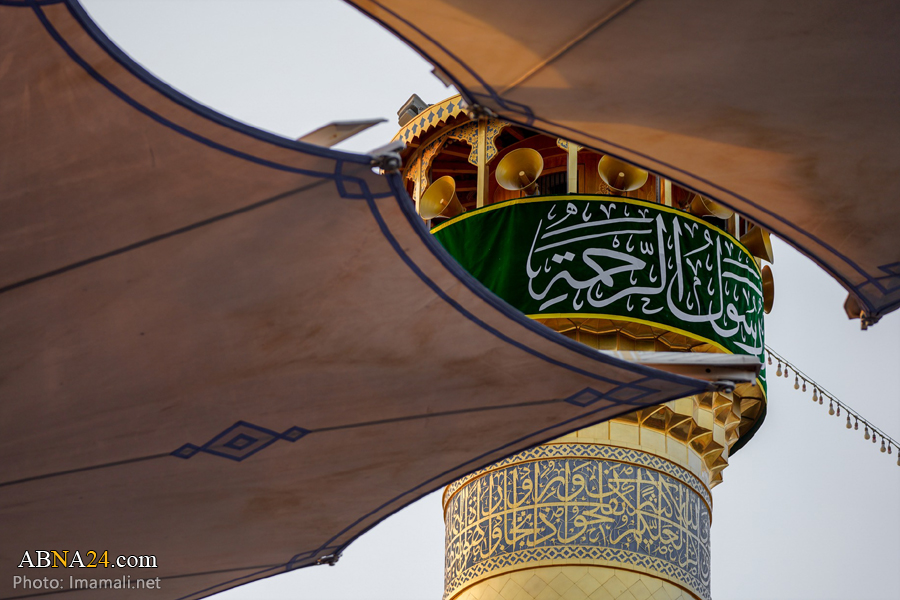 تقرير مصور / إكساء حرم امير المؤمنين (ع) بلافتات مناسبة ولادة النبي (ص)
