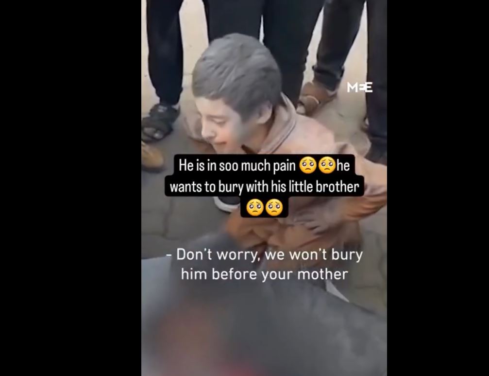 Video: Palestinian boy has to bury his younger brother killed by Israeli aggression in Gaza