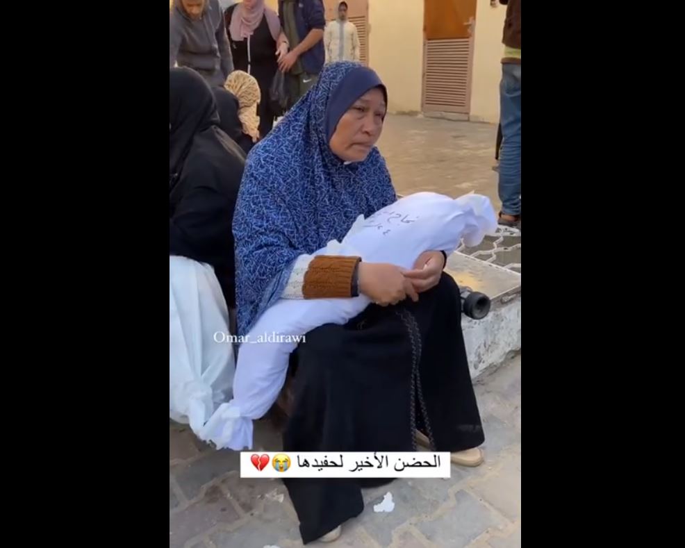 Video: Grieving grandmother hugs her young grandson murdered in Israeli bombardment on Gaza