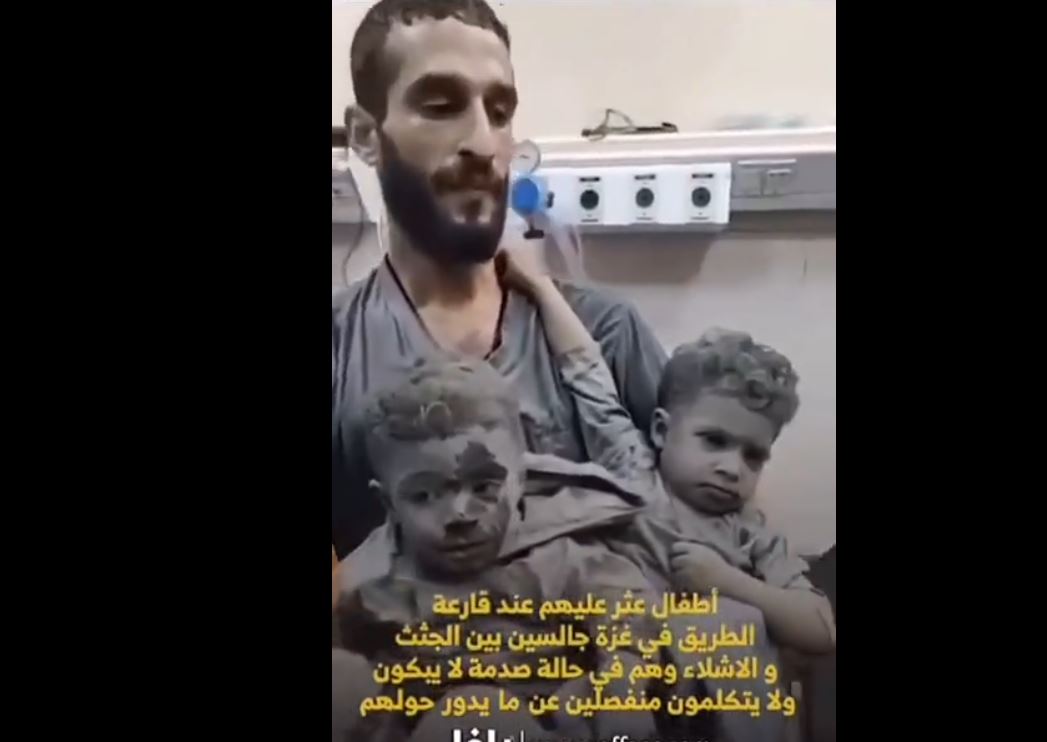 Video: This man found these children sitting in a pile of dead bodies frozen in a state of shock