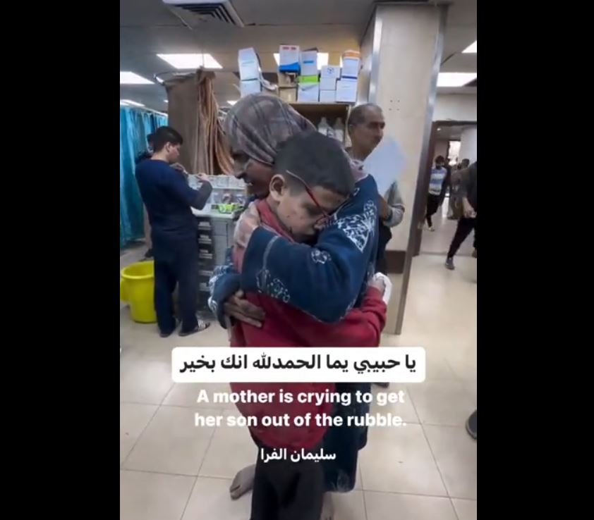 Video: A mother embraces her child after he rescued from under rubble of their home