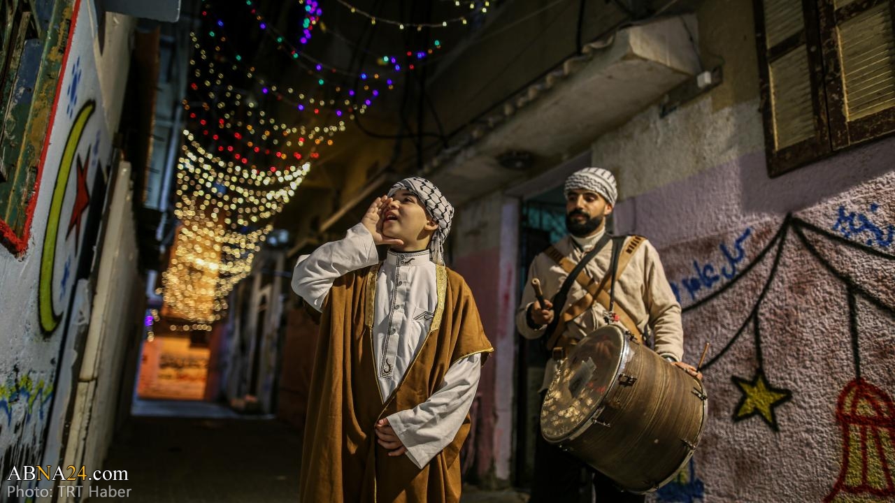 Photos: Ritual of drumming at dawns of Ramdan to wake up Muslims in Khan Yunis