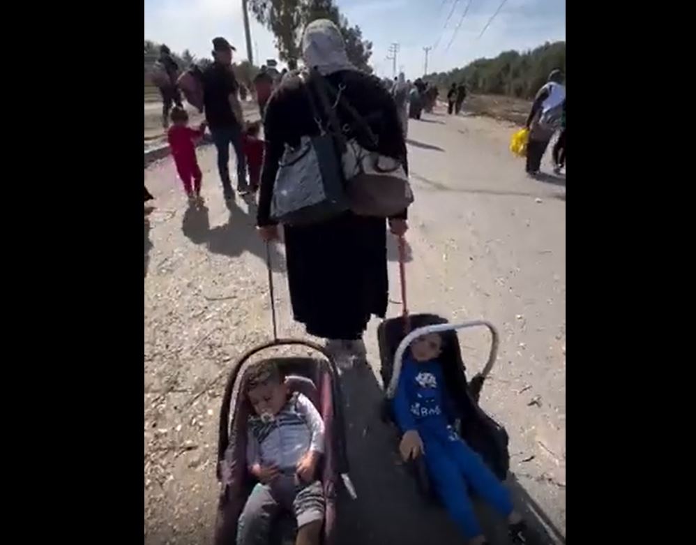 Video: Palestinian mother drags her children for hours to a safer place from Israeli bombardment