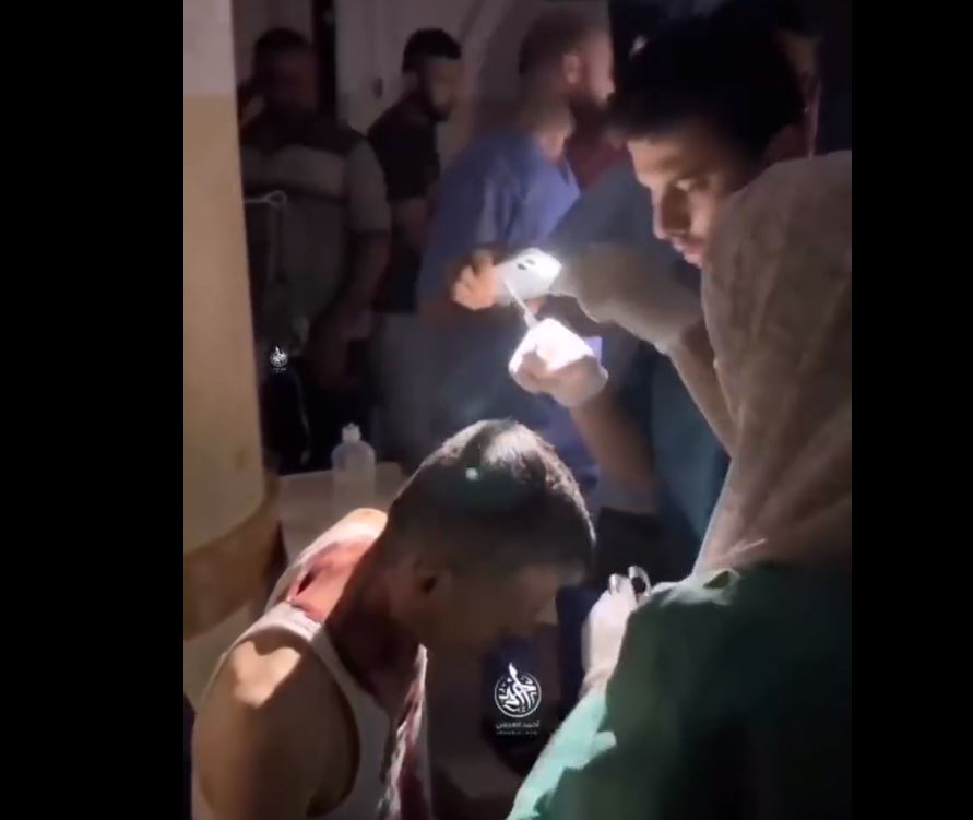 Medics of Indonesian Hospital in Gaza performing surgeries with flash lights due to power outage