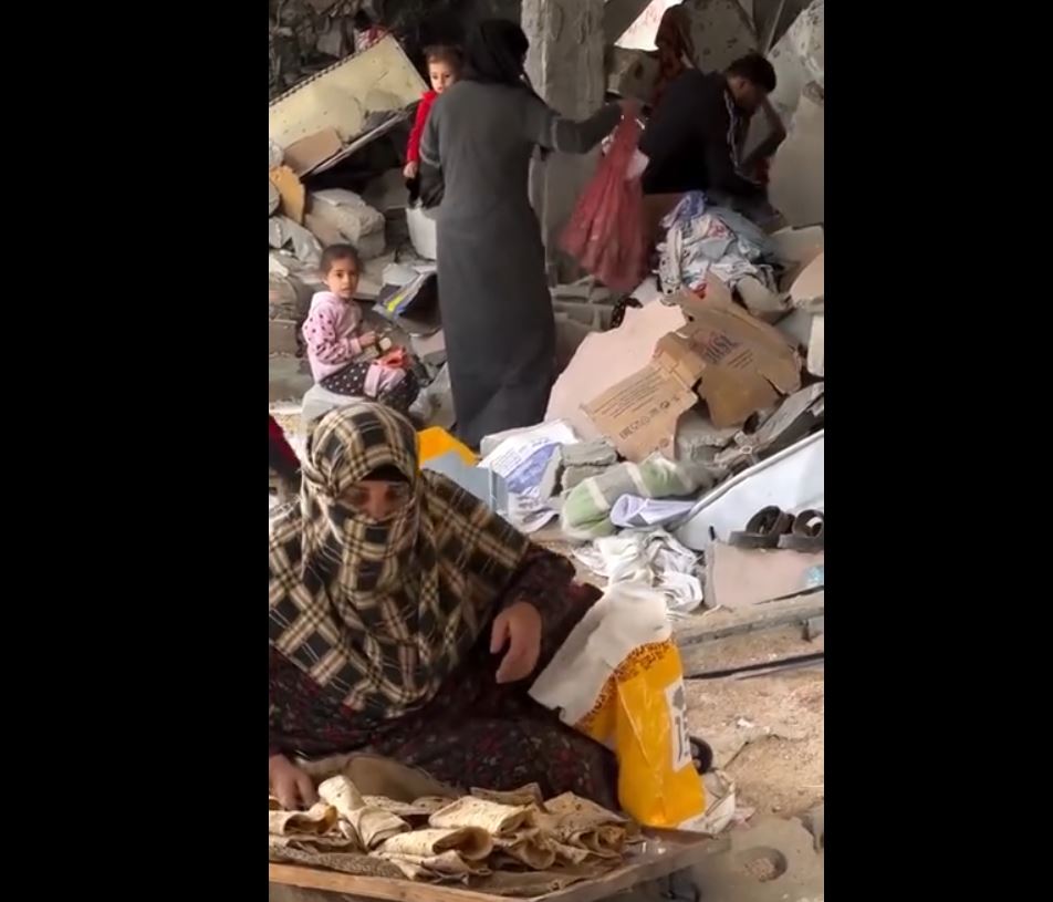 Video: Palestinian family collects their clothing from under rubble of their destroyed home 