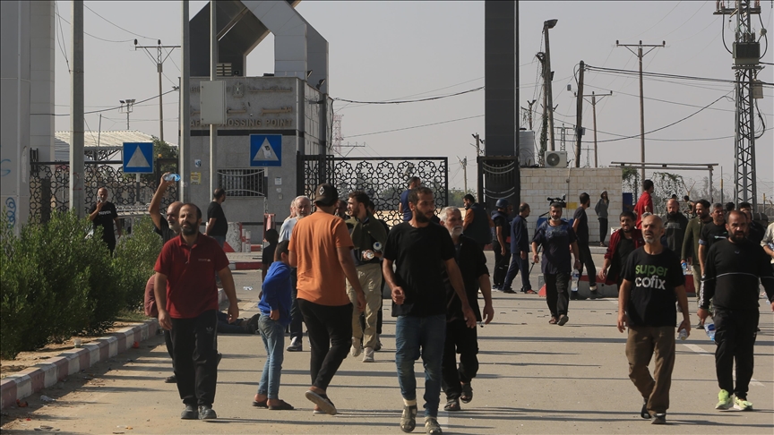 Thousands of Palestinian workers deported from Israel return to Gaza