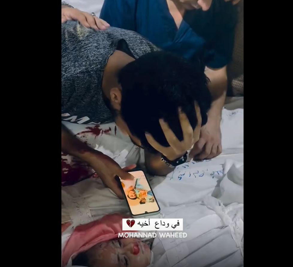 Video: Looking in old photos, Palestinian man bids farewell to his brother killed in Israeli bombing