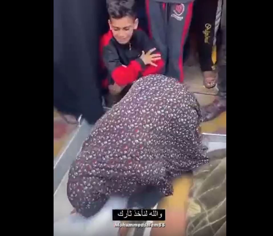 Video: Bereaved Palestinian girl bids farewell for her father v brother killed in Israeli airstrikes