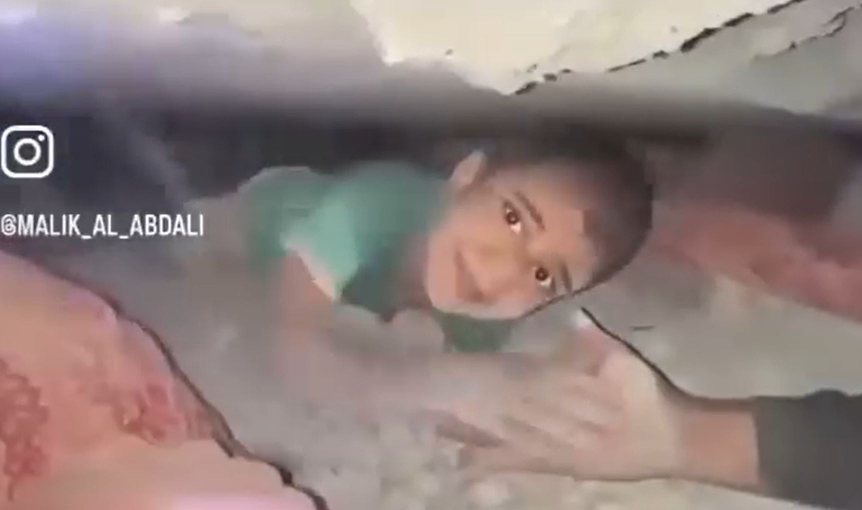 Video: Civil Defence pulled out a Palestinian child from rubble following Israeli targeting his family’s home in Gaza