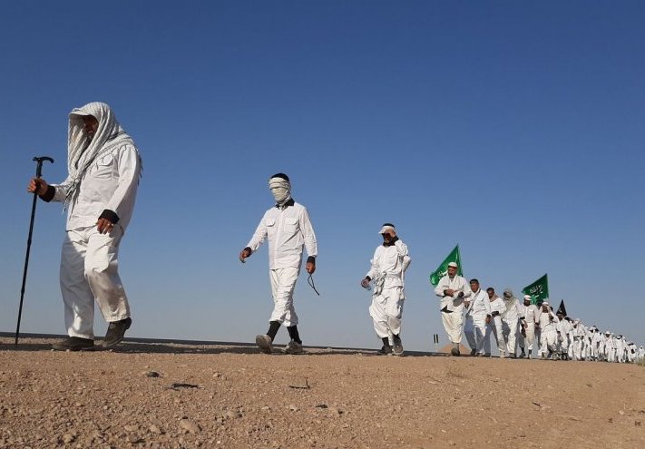 موكب انصار الحسين "عليه السلام" ينطلق من مشهد المقدسة ويصل الى العراق 
