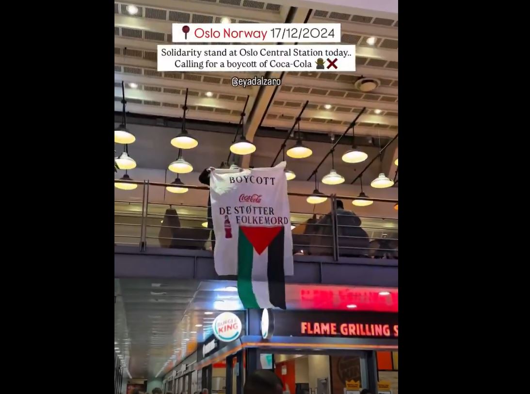 Video: Solidarity stand at Oslo central station calling to boycott Coca-Cola for complicity in Israeli genocide 