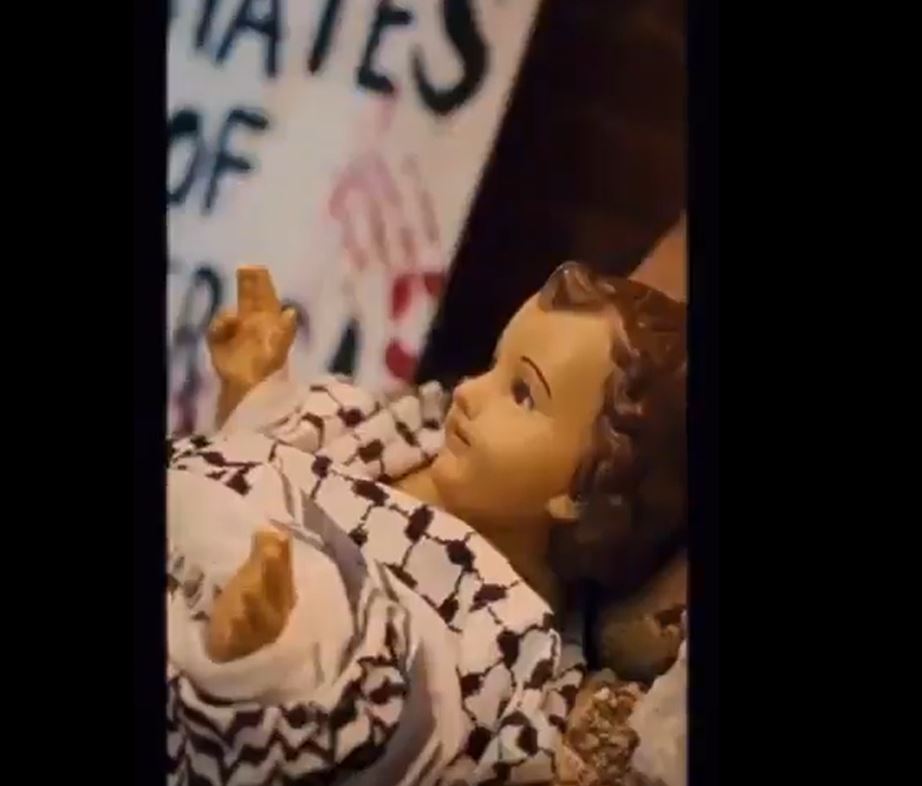 Video: Activists in Dallas placed a baby Jesus sculpture amidst rubble in condemnation of Israeli aggression