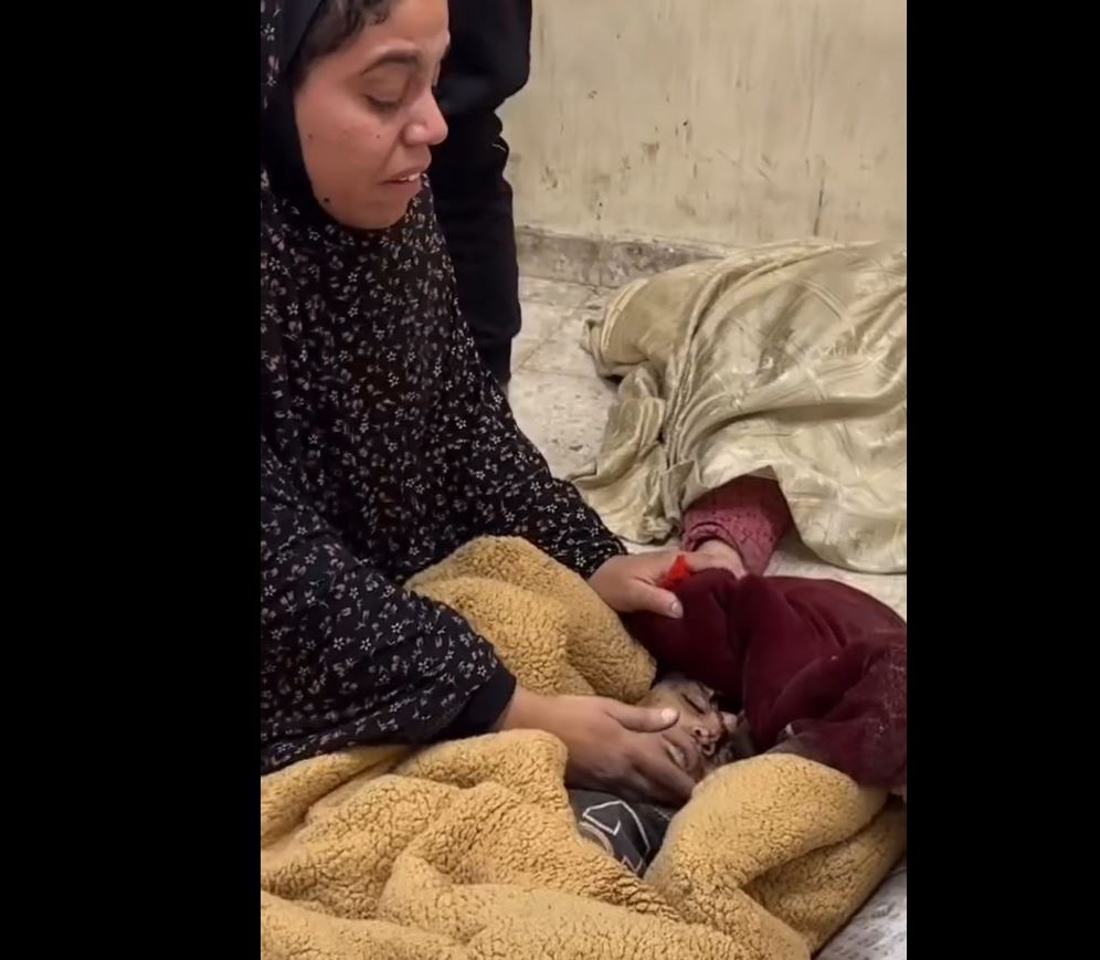 Sensitive video: Palestinian mother bids farewell to her child martyred by Israeli shelling in Nuseirat, central Gaza