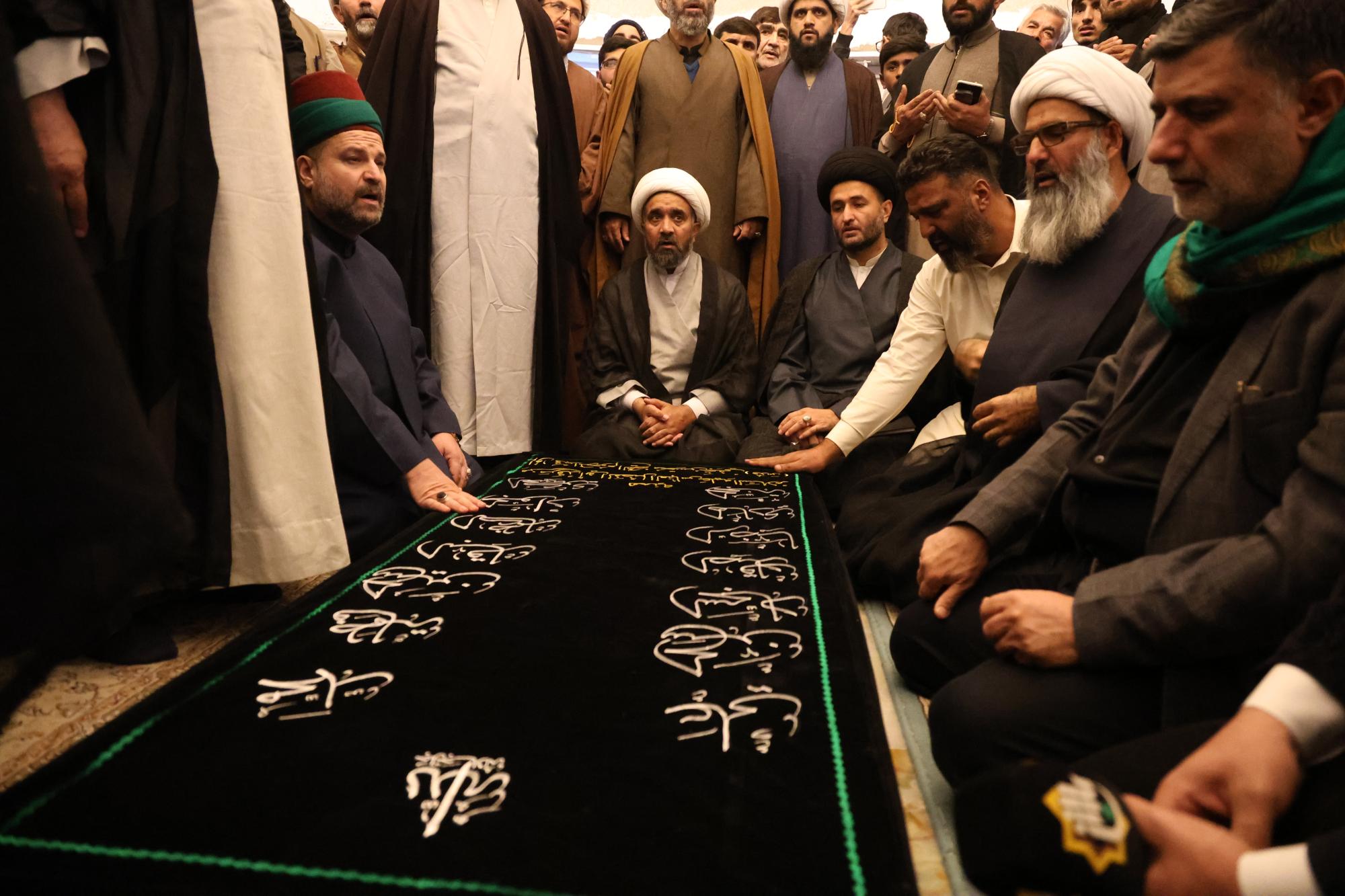 Raising the banner of Aba al-Fadl al-Abbas (peace be upon him) in the center of Al-Kawthar University in Pakistan