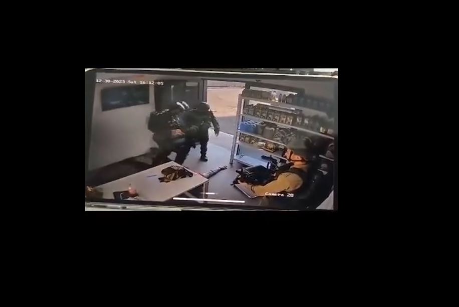 A surveillance video shows Zionist soldiers assaulting a worker at a petrol station in South Al-Khalil 