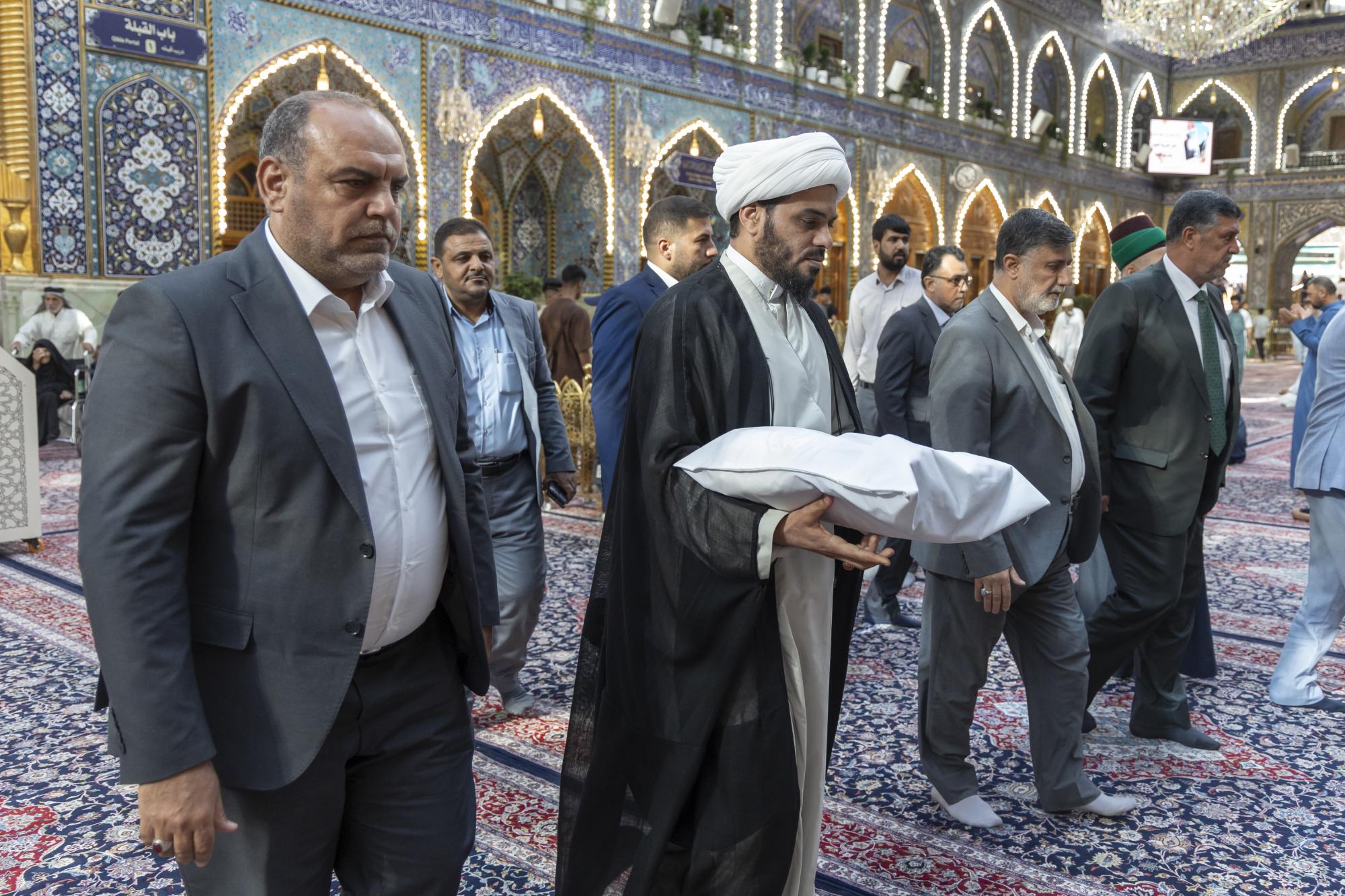 Coinciding with approaching Eid al-Ghadir, Imam Ali shrine presents wilayah banner to Al-Abbas shrine (+Photos)