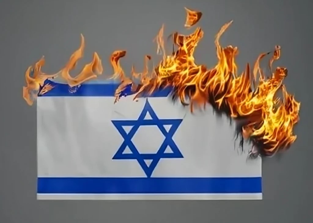Zionist forces arrest Jewish man burned Israeli flag, raised Palestinian one