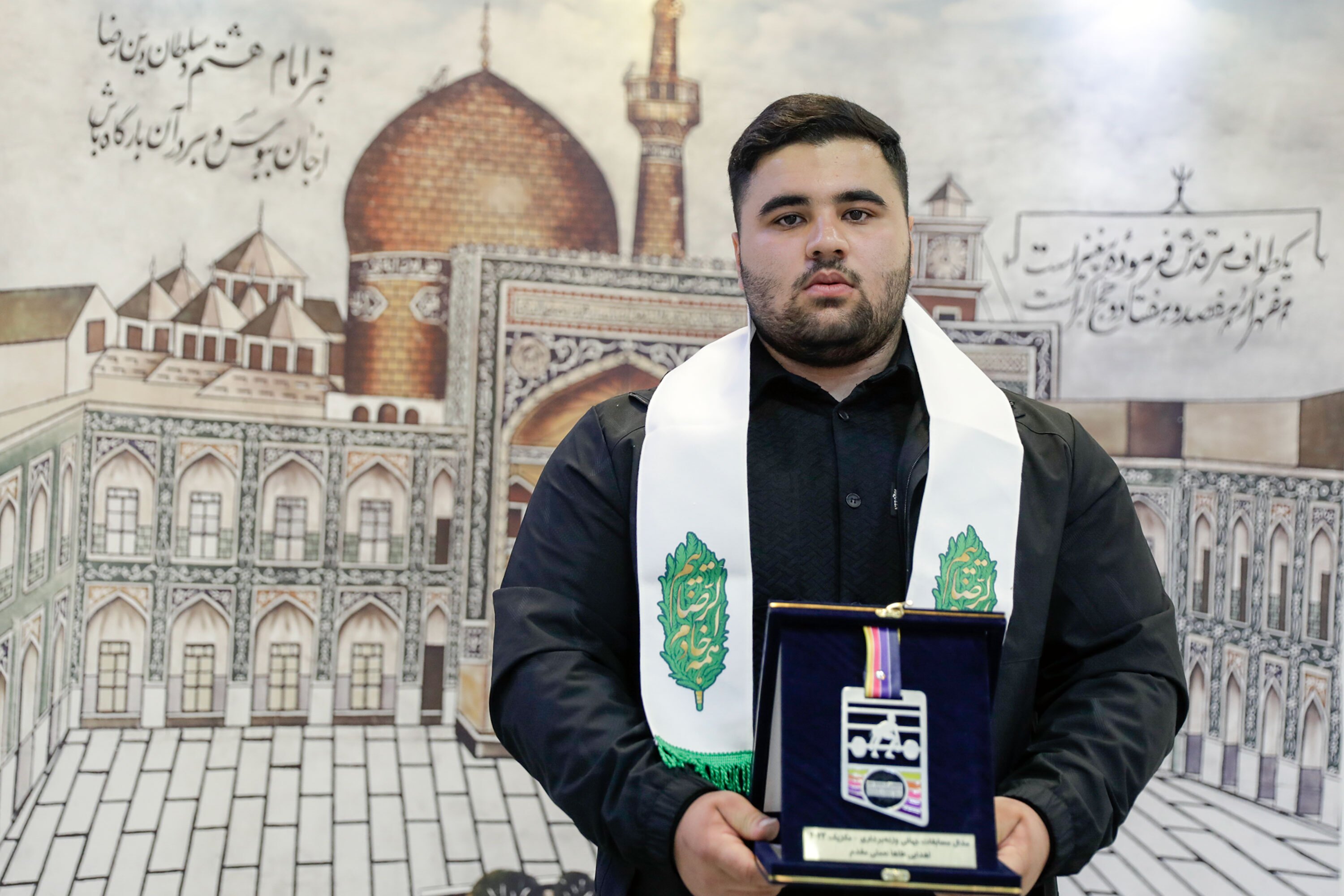 Junior weightlifter bestows world medal to Imam Reza Shrine museum