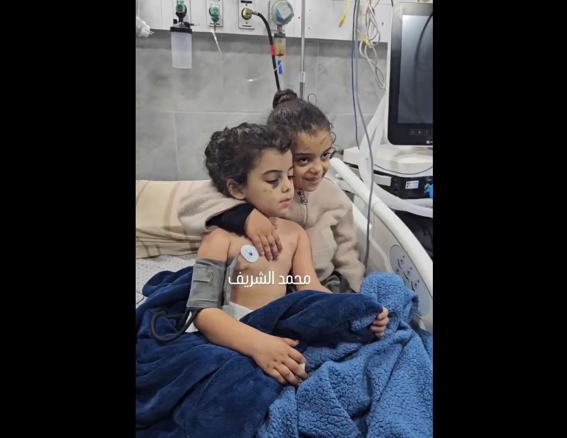 Video: A Palestinian child embraces her sister at Kamal Adwan Hospital after injured in bombardment of northern Gaza