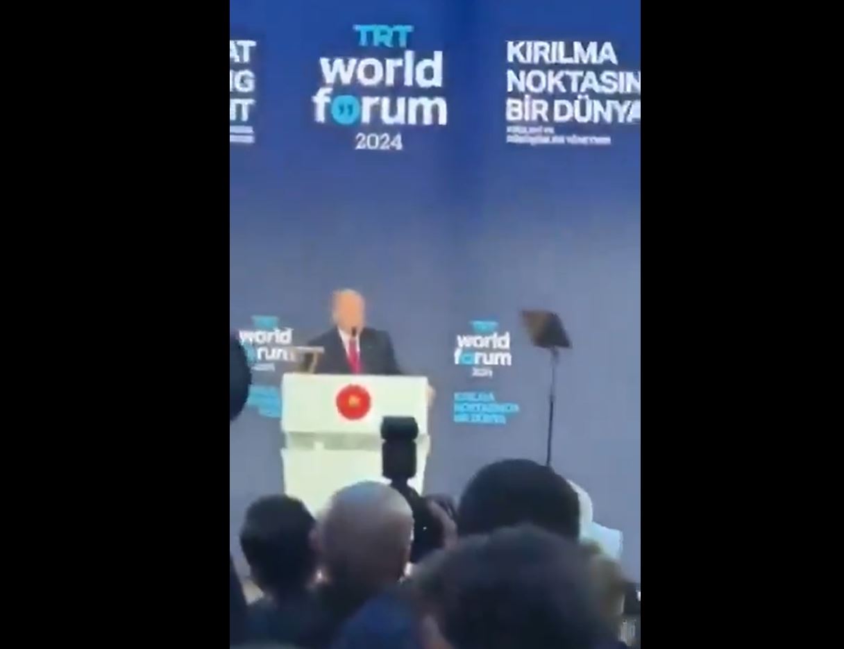 Photos: Protester interrupts Erdogan's speech, shouting, "Our ships deliver bombs to Israel"
