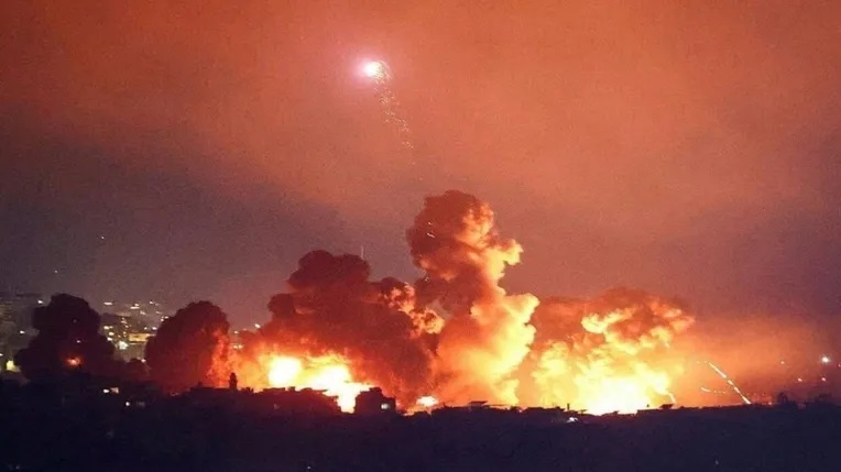 Israel launches violent raids on Beirut southern suburb, Hezbollah shells Israeli military bases, settlements