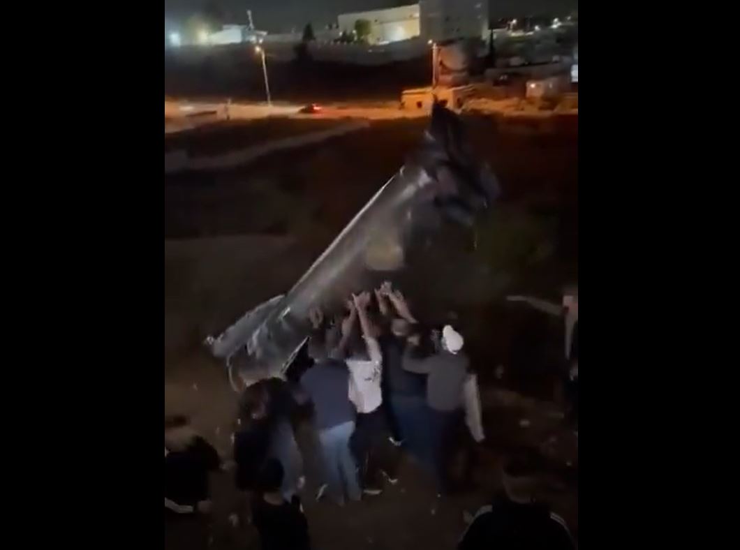Video: Palestinians taking pictures with an intercepted missile from Iran that fell in Ramallah, West Bank