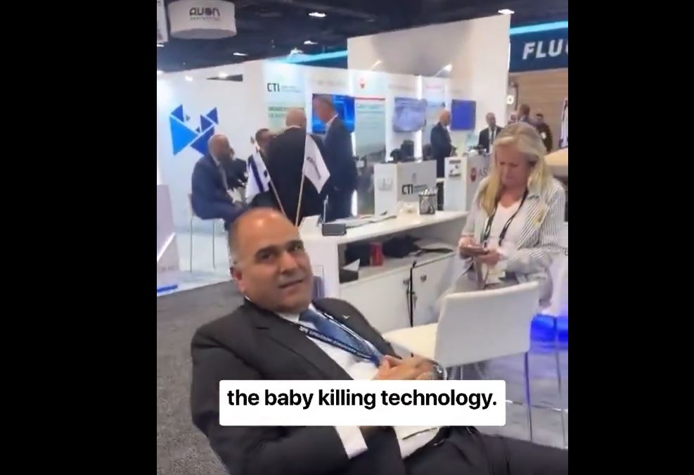 An activist goes to Israeli weapons manufacturers fair & ask: “We’re looking for baby killing technology…”