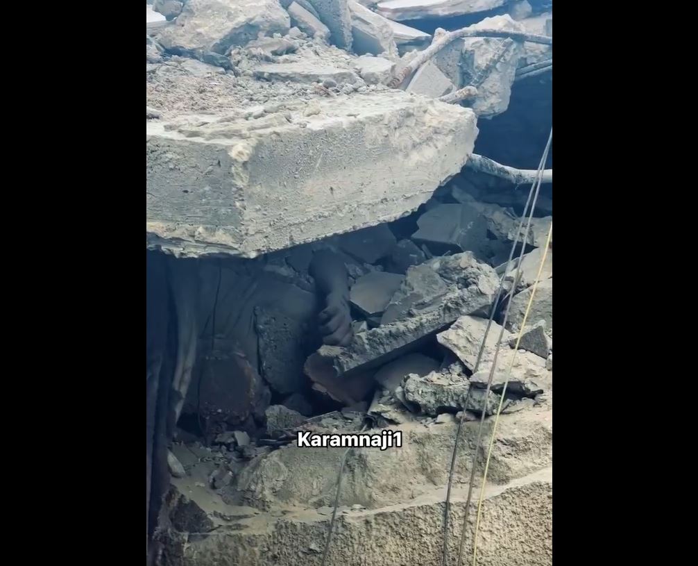A video shows a Palestinian body stuck under rubble of a home bombed by Israeli occupation in Gaza