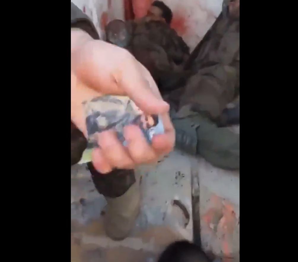 Video: Zionist enemies lying dead under feet of Radwan Hero holding image of martyr Ibrahim Haidar