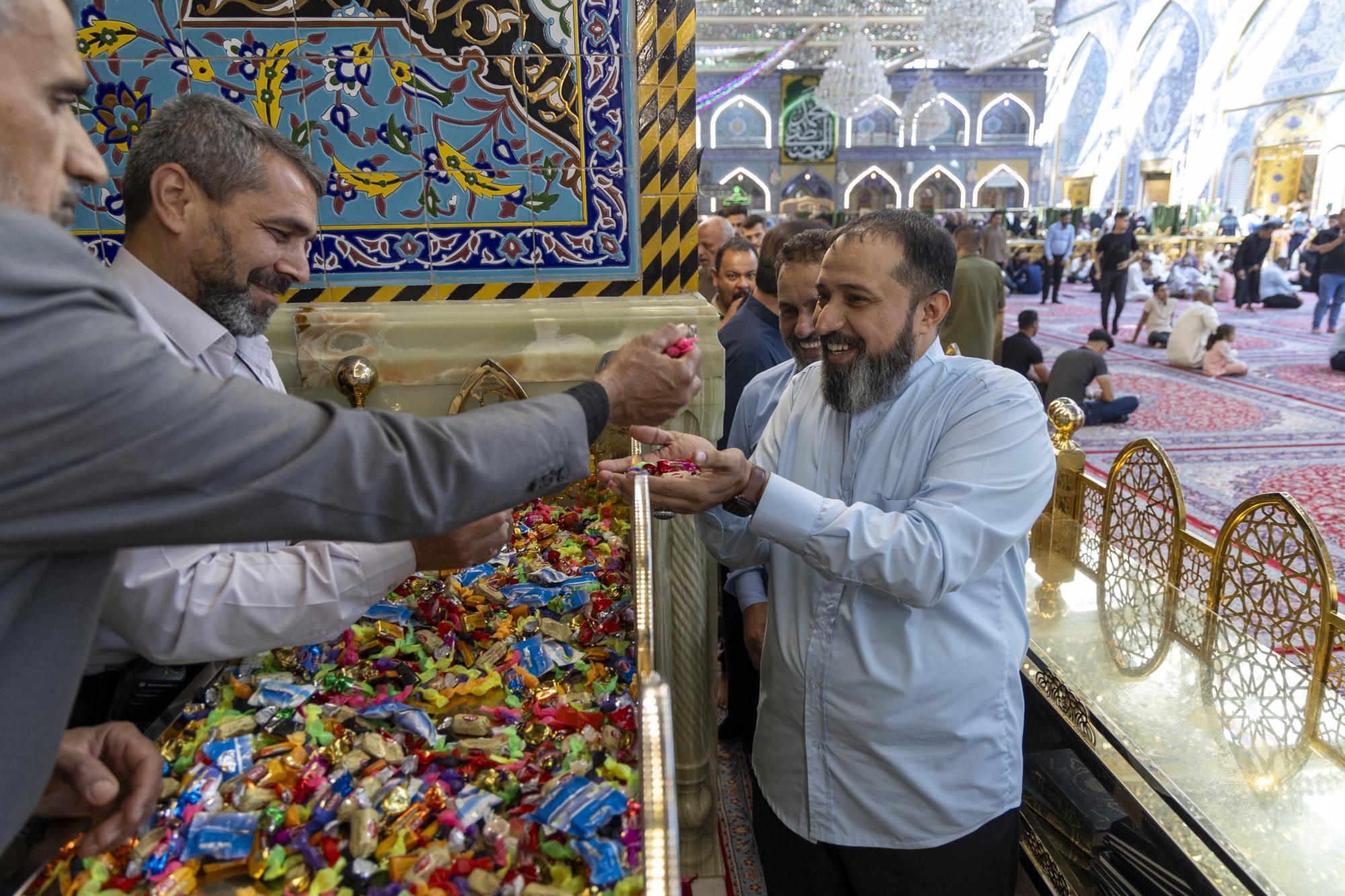 Staff of al-Abbas shrine presented sweets & roses to visitors on birth of Holy Prophet and Imam al-Sadeq 