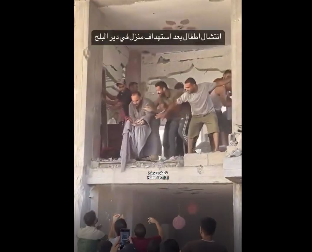 Video: An infant rescued from rubble of a building struck by Israeli occupation aircraft in Deir al-Balah