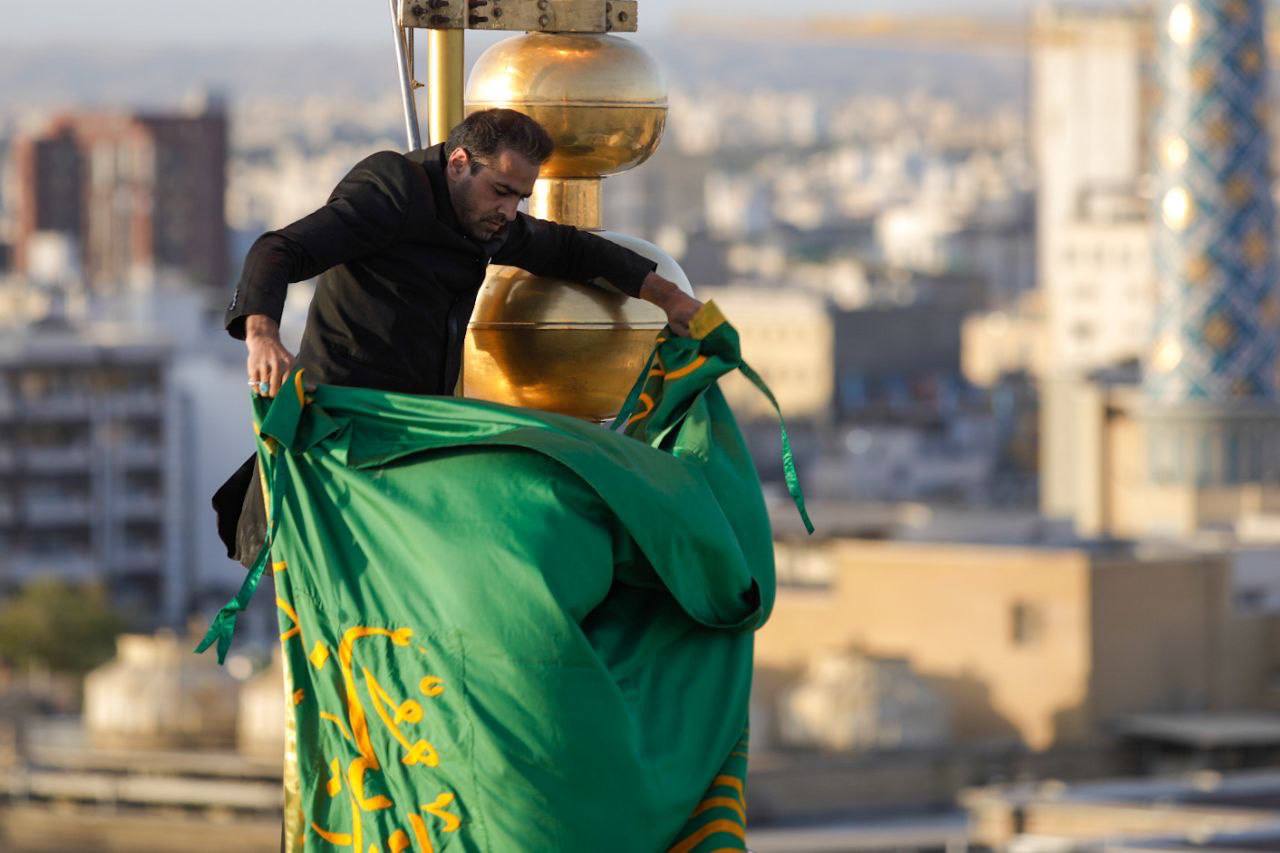 Photos: Flag of Imam Reza shrine changed after 63 days