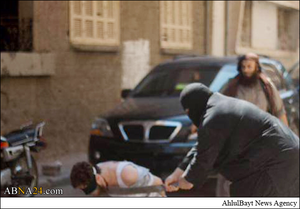 اعدام فجیع جوان سوری به دست داعش + تصاویر (18+)