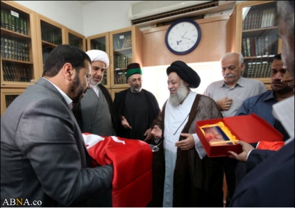 Image / Imam Hussain's Red Flag Presented to Ayatollah Jazayeri in Iran