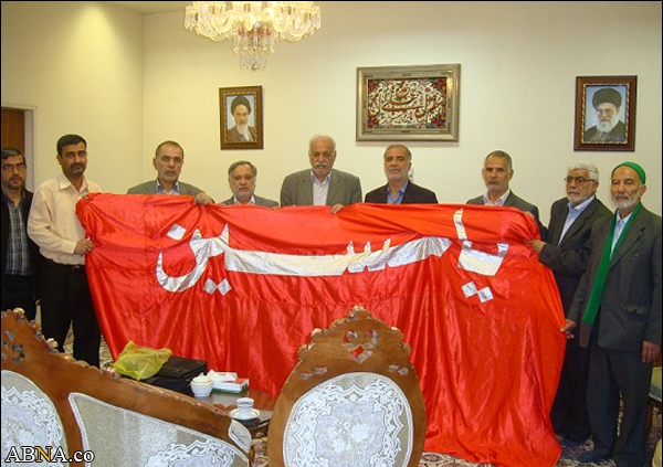 Image / Imam Hussain's Red Flag Presented to Imam Reza Holy Shrine