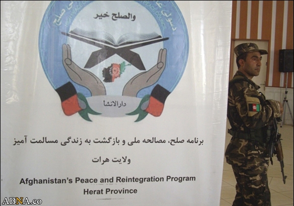 Image / Taliban fighters lay down their arms for love and peace