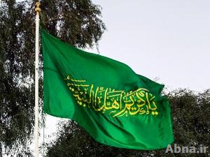 بالصور / رفع راية رمزية للإمام الحسن (ع) بمدينة الحلة تشبيهاً لراية مرقده المهدم في المدينة المنورة