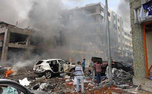 Syria will become 'graveyard of the invaders', country's prime minister warns as Assad considers options for retaliation