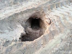 بالصور / مرتزقة النظام البحريني تعتدي بالجرف والتخريب على مقبرة "أبو صيبع"