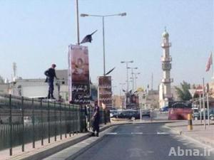 الشرطة البحرينية تحقق مع مواطنين علقوا أعلام "الامام الحسين (ع)" على منازلهم