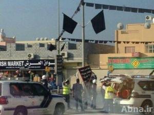 بالصور / قوات النظام البحريني تعتدي على يافطات عاشورائية بمنطقة "داركليب"