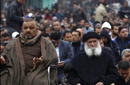 Image / Shiite Muslims attend Friday prayers in Baghdad