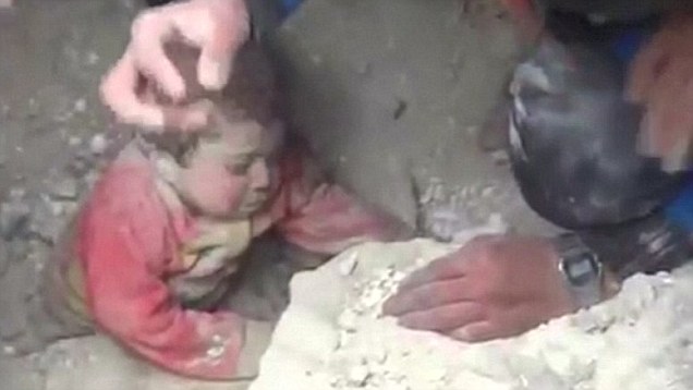 Syrian child found alive under rubble of bombed building