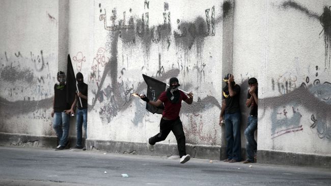 Bahraini court issues long jail terms for 13 protesters