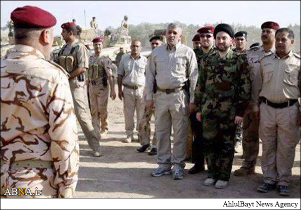 Prominent Iraqi cleric put on battle outfit against ISIL Takfiri terrorists