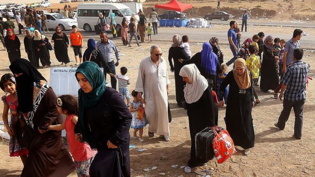 Thousands of of Iraqis flee Christian areas after ISIL attack