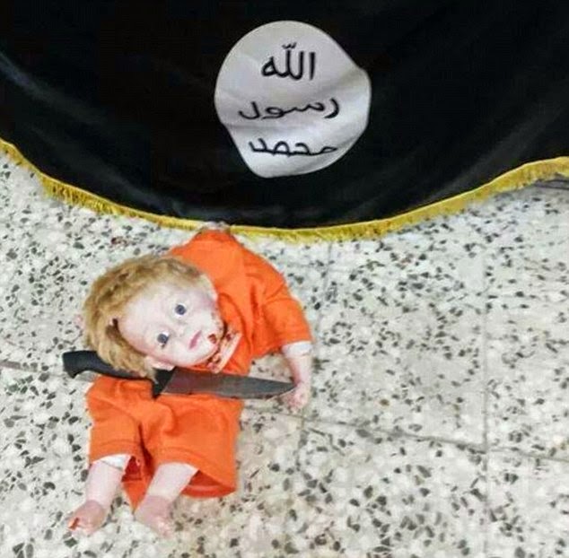 Shocking! Child Jihadi re-enacts murder of James Foley by executing a doll / Pics