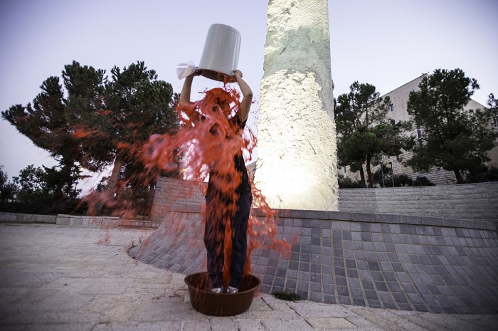 ‘Jews Against Genocide’ take the blood bucket challenge at Yad Vashem