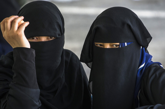 China's Urumqi Bans Islamic Veil, Sparking Rights Concerns