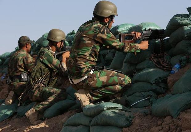 Kurdish Peshmerga fighters take control of key village in Iraq